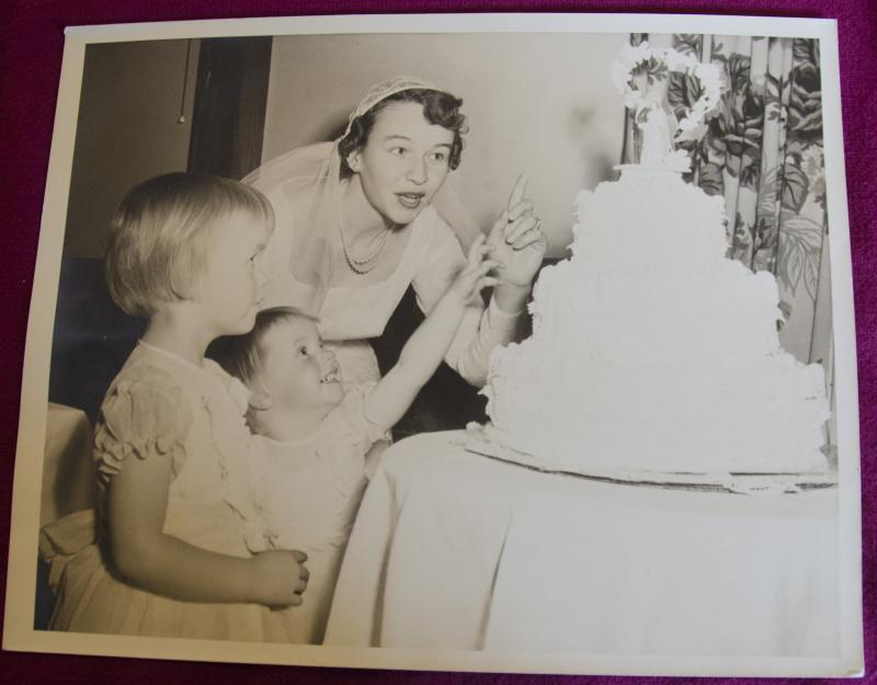 A snapshot of Shirley Fraser Costin in 1951 with two of her young guests. BY ROCHESTER HISTORICAL SOCIETY